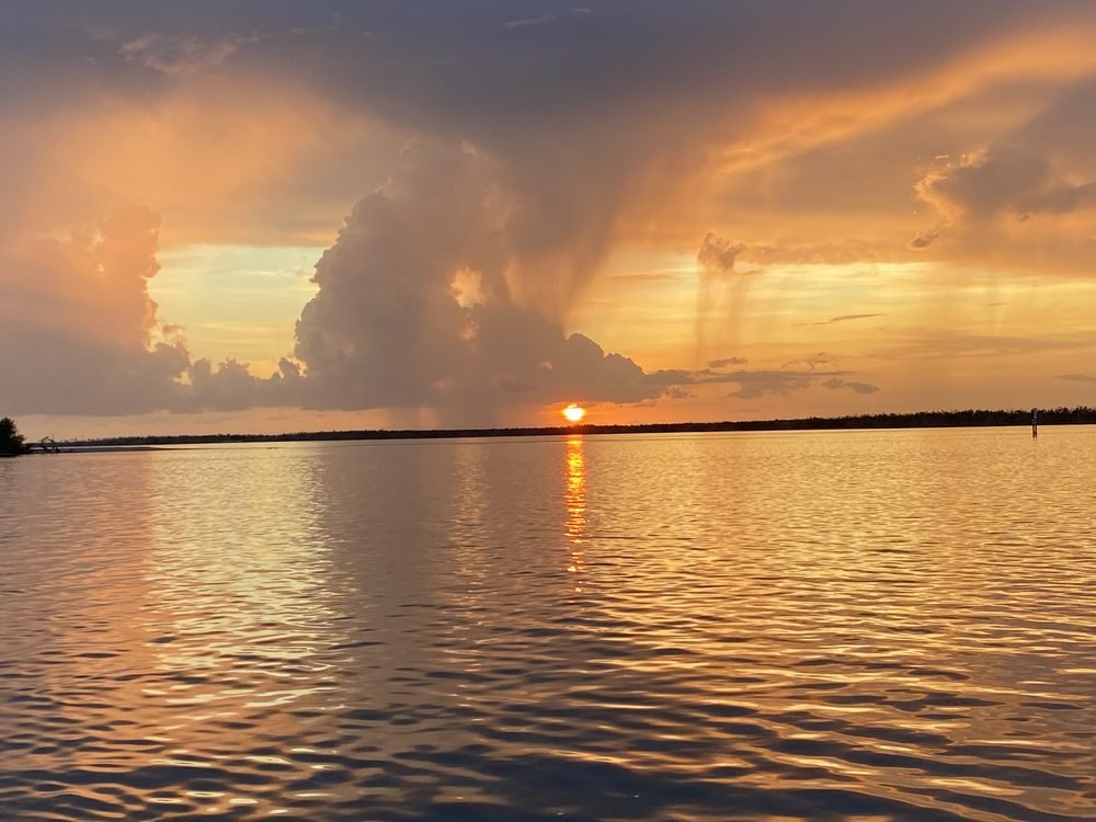 A dramatic Southwest Florida sunset over the water seen from the boat